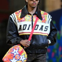 Jules Kounde of FC Barcelona arrives at the stadium wearing a collection of clothes and accessories fashioned from the UEFA Champions League official...