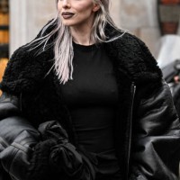 Julia Fox is seen wearing a black faux leather black trim coat, black skirt outside the Vetements show during the Womenswear Fall/Winter 2024/2025 as...
