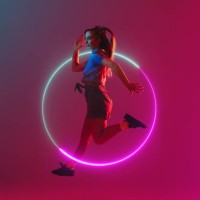 jumping through a neon hoop - fashion stock pictures, royalty-free photos & images