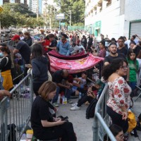 June 2023, Brazil, São Paulo: People sleep and wait outside the Allianz Parque stadium in the hope of buying tickets for 
