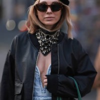 Karin Teigl seen wearing Celine brown sunglasses, Gucci black beret hat, H&M Studio light blue sleeveless denim / jeans long dress, Edited black...
