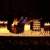 Katerina Boichuk on violin and Olena Zhukova on piano perform during Light classics by candlelight at the Architect's House organised by Svitlo...