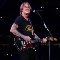 Keith Urban performs onstage at the Concert For Carolina Benefit Concert at Bank of America Stadium on October 26, 2024 in Charlotte, North Carolina.