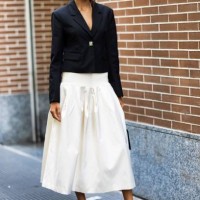 Kelly Gale is seen wearing a white wide skirt and short black blazer outside Fendi show during the Milan Fashion Week - Womenswear Spring/Summer 2024...