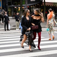 Kerry Denevan is seen wearing a black blazer, laced dress, black heels and sunglasses with a Chanel bag with Lya Mariella is seen wearing a Windsor...