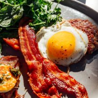 keto breakfast with fried egg, bacon, cheese, ground beef and salad - food stock pictures, royalty-free photos & images