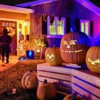 kids trick or treating on halloween night in suburban californian house - garden decoration stock pictures, royalty-free photos & images