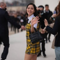 Kim Ji-soo aka Jisoo from Blackpink wears a white shirt from Dior, a black tie from Dior, a gray blazer jacket from Dior ,a white / yellow / black...