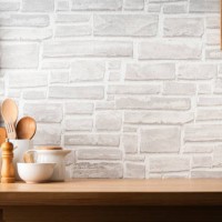 kitchen countertop with utensils and brick wall background. copy space available - food stock pictures, royalty-free photos & images