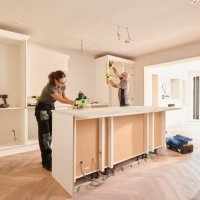 kitchen fitters installing some cabinets - home decoration stock pictures, royalty-free photos & images