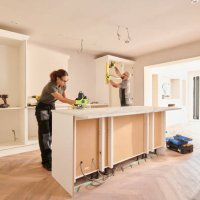 kitchen fitting team installing - home decoration stock pictures, royalty-free photos & images