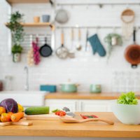 kitchen table with vegetables and cutting board for preparing salad . - food stock pictures, royalty-free photos & images