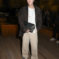 Korapat Kirdpan at the Coach Fall RTW 2025 fashion show as part of New York Fashion Week held at the Park Avenue Armory on February 10, 2025 in New...