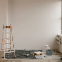 ladder by paint equipment near white wall at home - home decoration stock pictures, royalty-free photos & images