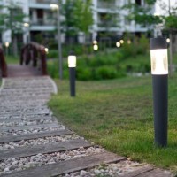 lamps by the footpath in an elegant courtyard at evening - garden decoration stock pictures, royalty-free photos & images