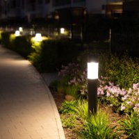 lamps by the sidewalk in an elegant courtyard at night - garden decoration stock pictures, royalty-free photos & images