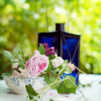 lantern and rose on a garden table. - garden decoration stock pictures, royalty-free photos & images
