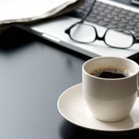 laptop and a cup of coffee on office desk - coffee stock pictures, royalty-free photos & images