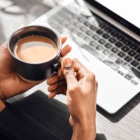 laptop, keyboard or hands of black man with coffee to relax, drink or enjoy during morning work break. cup of tea for person working on social media content writing, online blog or digital seo mockup - coffee stockfoto's en -