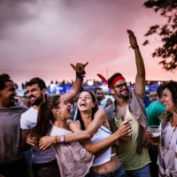 large group of cheerful friends dancing on an outdoor party. - concert stock pictures, royalty-free photos & images