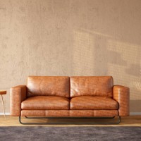 leather sofa with an empty beige wall for mockup - home decoration stock pictures, royalty-free photos & images