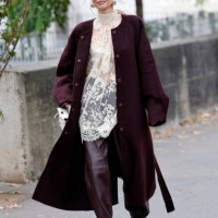 Leonie Hanne wears cream lace sheer blouse, burgundy leather pants, burgundy coat, white Hermes bag, burgundy Celine sunglasses, outside Zimmermann,...