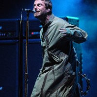 Liam Gallagher of Oasis performs as the band headline the main stage on day 1 of the International Festival of Benicassim on July 16, 2009 in...