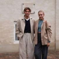 Lili Hamann seen wearing beige blazer jacket, blue crop top, beige pair of jeans, Adidas Gazelle sneakers and brown vintage Dior Saddle Bag and Levin...