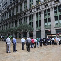 Line of lunch time customers at a mobile street vendor selling food in the business district in downtown Manhattan, New York City, USA. 16th...