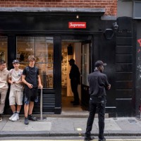 Line of young men queue up outside the Supreme store in Soho on 9th July 2023 in London, United Kingdom. Each week the fashion label Supreme, which...