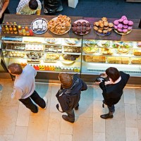 lining up at cafe' with tasty pastry for a snack. - junk food stock pictures, royalty-free photos & images