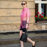 Lisa Banholzer is seen wearing pink sheer button shirt Miu Miu, slipper Miu Miu, bag vintage, cycle pants, sunglasses during Mercedes Benz Fashion...