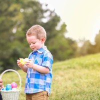 little boy, father hunting easter eggs at park. - garden decoration stock pictures, royalty-free photos & images