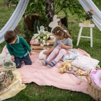 little brother and sister on easter egg hunt in blooming spring garden - garden decoration stock pictures, royalty-free photos & images