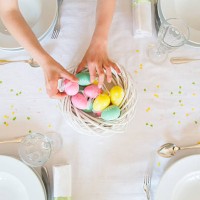 little girl decorating dining table with easter eggs - home decoration stock pictures, royalty-free photos & images