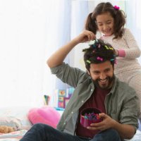 little girl doing father's hair - hairstyle stock pictures, royalty-free photos & images
