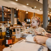 little girl eating pancake in restaurant - food stock pictures, royalty-free photos & images