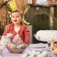 little girl smiling at the easter table - garden decoration stock pictures, royalty-free photos & images