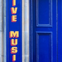live music sign painted in yellow on the blue exterior wall of a pub. edinburgh. scotland. - concert stock pictures, royalty-free photos & images