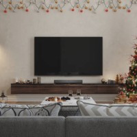 living room interior with christmas tree, ornaments, gift boxes, red sofa and lcd tv set - home decoration stock pictures, royalty-free photos & images