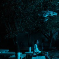 lonely man in the empty night garden - garden decoration stock pictures, royalty-free photos & images