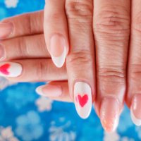 long fingernails in pink color and heart shape - nails art stock pictures, royalty-free photos & images