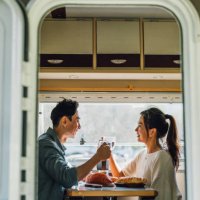 lovely asian chinese couple enjoy breakfast with their camper van - camper van travel series - travel stock pictures, royalty-free photos & images