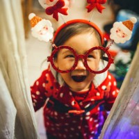 lovely little toddler with christmas eyeglasses smiling joyfully at camera - home decoration stock pictures, royalty-free photos & images