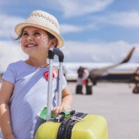 lovely toddler with a yellow coffer - travel stock pictures, royalty-free photos & images