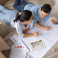 loving couple sketching a design to decorate their new house - home decoration stock pictures, royalty-free photos & images