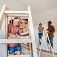 loving mother and daughter on ladders during home renovation process. - home decoration stock pictures, royalty-free photos & images