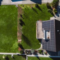 low aerial close view new dense rural housing development, mostly grey roofing, some green landscaping, young trees. modern homes with flat roof - garden decoration stock pictures, royalty-free photos & images