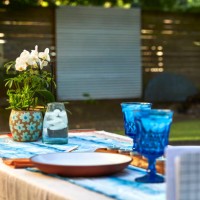 low angle shot of a table setup for a formal dinner in a back yard at sunset. - garden decoration stock pictures, royalty-free photos & images
