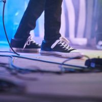 low section of a person's foot on a stage performance rock concert event - concert stock pictures, royalty-free photos & images